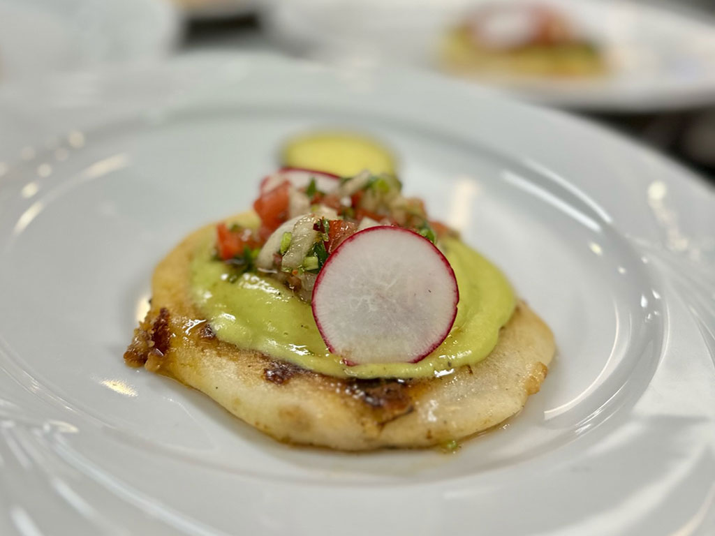 Turkey stuffed pupusa, avocado crema and pebre sauce